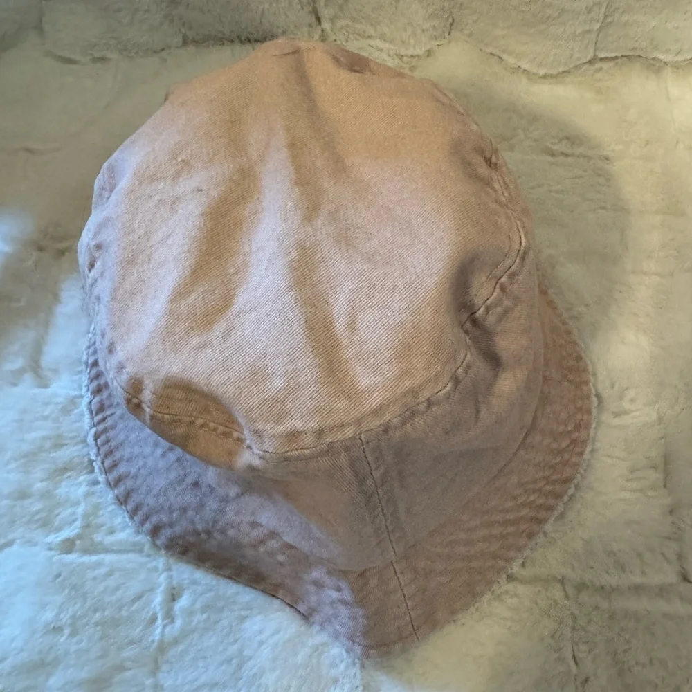 David and Young Khaki colored Bucket Hat. Has a Butterfly on the front New